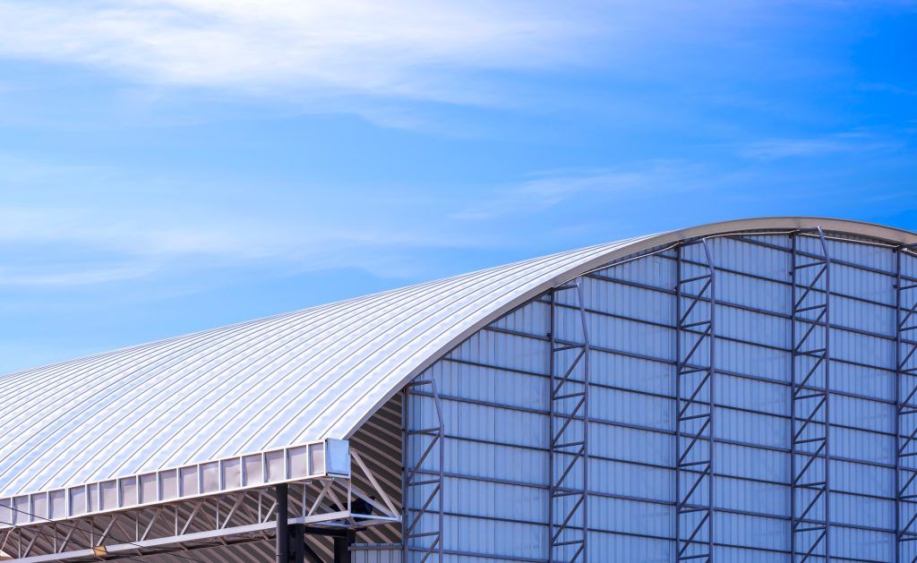 Renovation and addition of aluminium corrugated metal wall to outdoor multi-purpose building